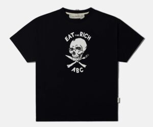 A T-shirt with a bold graphic of a skull and crossed cutlery beneath the slogan “Eat the Rich” and ABC branding